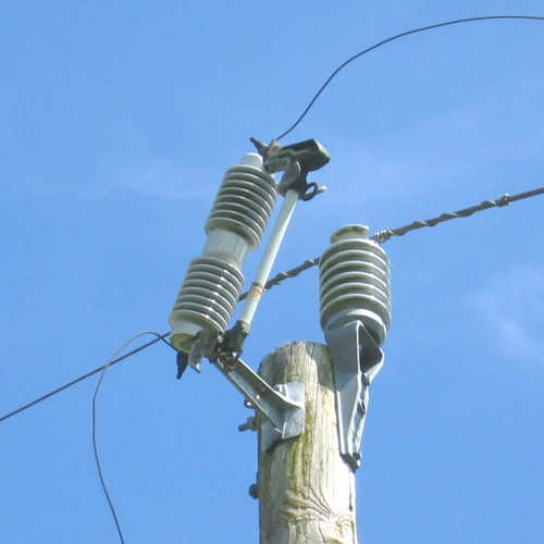 High-voltage fuse cutout on utility pole | Metro Powerline